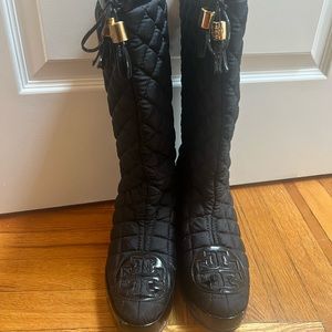 Pre-worn black Tory Burch quilted wedge boots.
